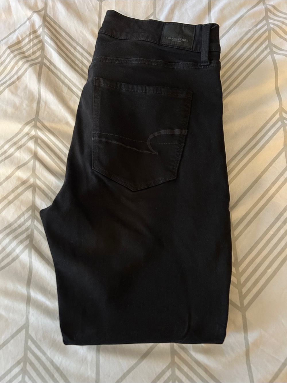 American Eagle women’s jet black stretch jeans - distressed knees 14L
